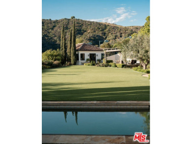 At the end of a cul-de-sac in ultra-exclusive Brentwood Country