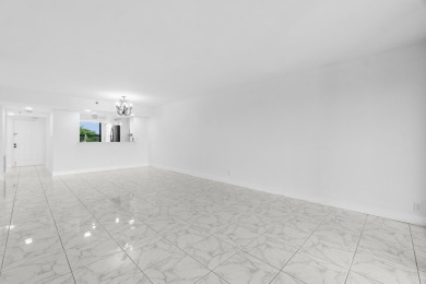 Beautifully renovated home with an amazing lake and golf view in