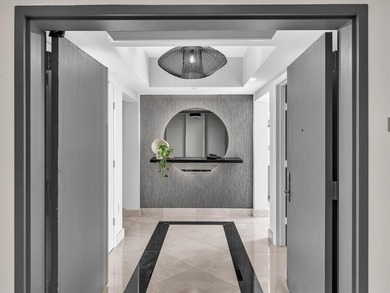 Experience luxury oceanfront living in this renovated 2-bedroom