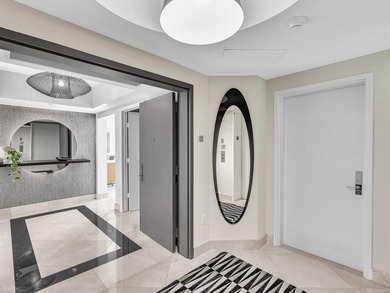 Experience luxury oceanfront living in this renovated 2-bedroom