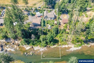 New Price on this Riverfront Gem! Experience refined living in