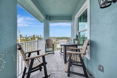 Enjoy paradise on South Hutchison Island from this beautiful