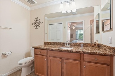 This rarely available second-floor end unit in Bonita National