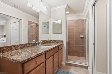 This rarely available second-floor end unit in Bonita National