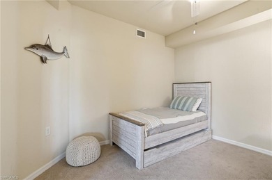 This rarely available second-floor end unit in Bonita National