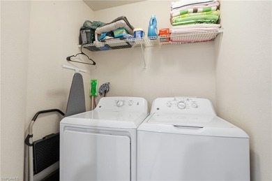 This rarely available second-floor end unit in Bonita National