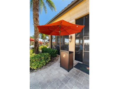 This rarely available second-floor end unit in Bonita National