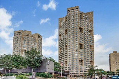 Experience luxury high-rise living at its finest in this