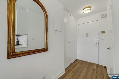 Experience luxury high-rise living at its finest in this