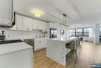 Experience luxury high-rise living at its finest in this