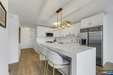 Experience luxury high-rise living at its finest in this