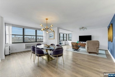 Experience luxury high-rise living at its finest in this