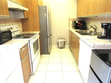 TURNKEY 1 BEDROOM, 1.5 BATHS. TILE IN LIVING AREAS, CARPET IN