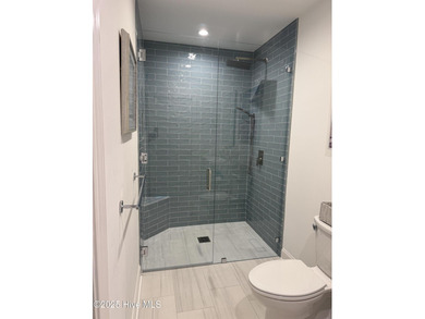 Experience elevated coastal living on highly sought-after