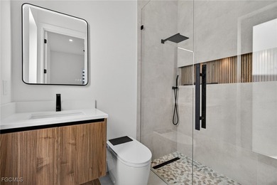 This stunning NEW CONSTRUCTION home is the epitome of modern