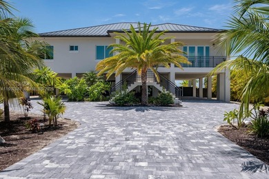 Nestled on the exclusive, gated island of Sunrise Isles in