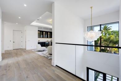 This extraordinary new-construction waterfront estate offers a