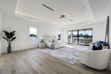 This extraordinary new-construction waterfront estate offers a