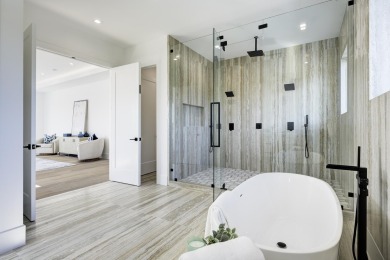 This extraordinary new-construction waterfront estate offers a