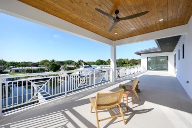 This extraordinary new-construction waterfront estate offers a