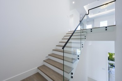 This extraordinary new-construction waterfront estate offers a