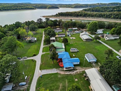 Discover your .48 ac m/l lakefront retreat in Indian Meadows