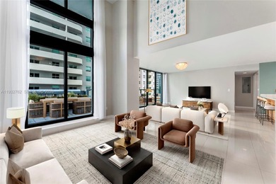 Discover a rarely available townhouse-style condo ideally