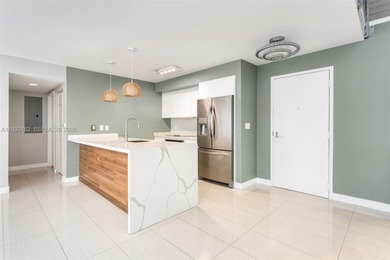 Discover a rarely available townhouse-style condo ideally