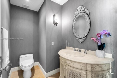 Spectacular 3-bedroom, 5-bath residence in the highly