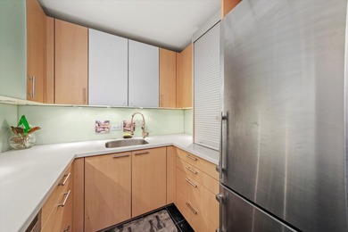 This sophisticated corner condo is an ideal full-time residence