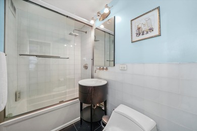 This sophisticated corner condo is an ideal full-time residence