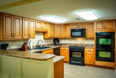 Easy beach access from this updated ground floor condominium at