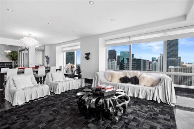 This exceptional 3-bedroom, 4-bath residence at the prestigious