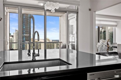 This exceptional 3-bedroom, 4-bath residence at the prestigious