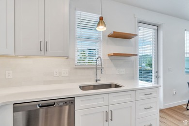 Experience this homes impeccable location in Daybreak's vibrant