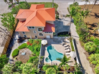 Nestled between the Gulf and Bay, this stunning beachfront home