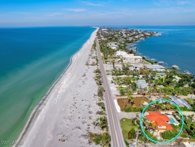 Nestled between the Gulf and Bay, this stunning beachfront home