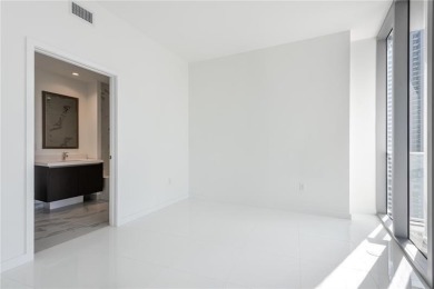 Welcome to this 19th floor corner unit boasting bay views and