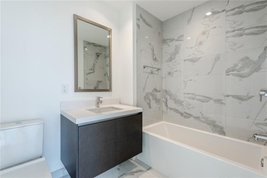 Welcome to this 19th floor corner unit boasting bay views and