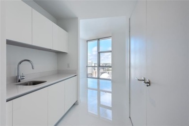 Welcome to this 19th floor corner unit boasting bay views and