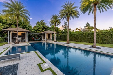 Upon entry, a breathtaking resort-style pool with Bali-inspired