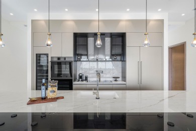 This exceptional just-completed penthouse at Aria offers a rare