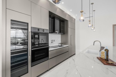 This exceptional just-completed penthouse at Aria offers a rare