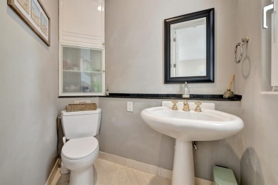 Newly priced! This gorgeous three level townhome located in an