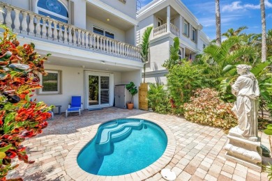 Newly priced! This gorgeous three level townhome located in an