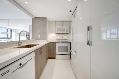 Experience Brickell Key living in this modern fully renovated 2