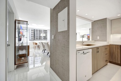Experience Brickell Key living in this modern fully renovated 2