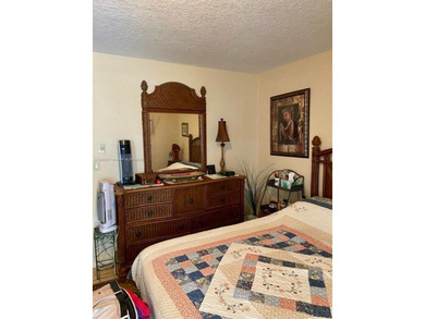 Beautiful and bright 1/1 condo in a desirable 55+ community in