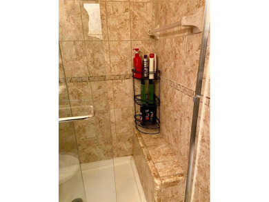 Beautiful and bright 1/1 condo in a desirable 55+ community in