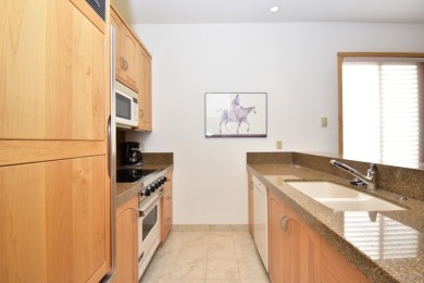 This unique property masterfully blends two Wildflower condo